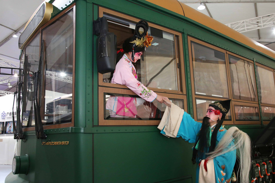 Tradition meets technology: Wu Opera performers take over car show