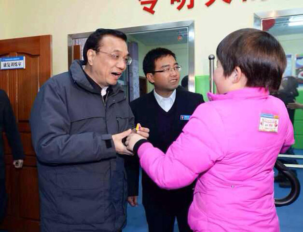 Li reaffirms commitment to social welfare system