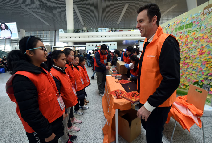 Offering holiday cheer during train station travel rush