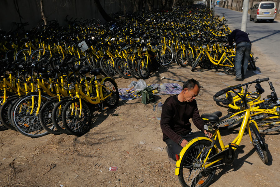 Repairmen race to get shared bikes back on the streets