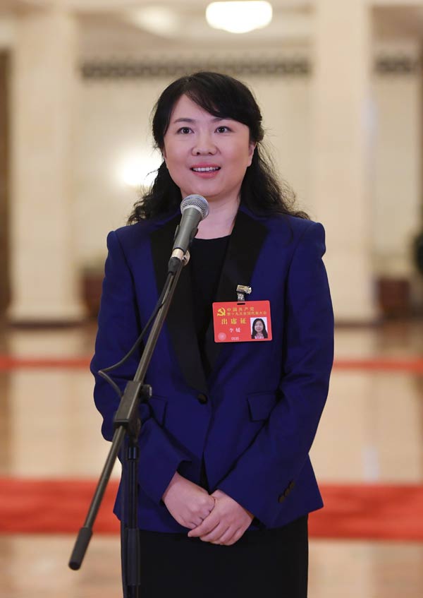 Delegates pick up questions at the Great Hall of the People