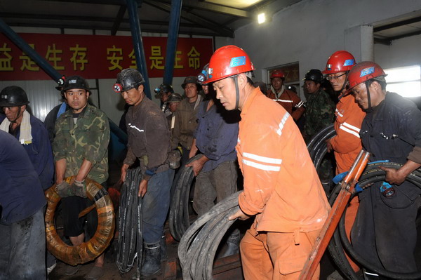 Rescue continues for 28 trapped miners