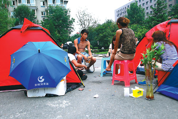 Beijing flood death toll hits 77