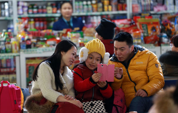 Railway station workers enjoy happy crowds of travelers