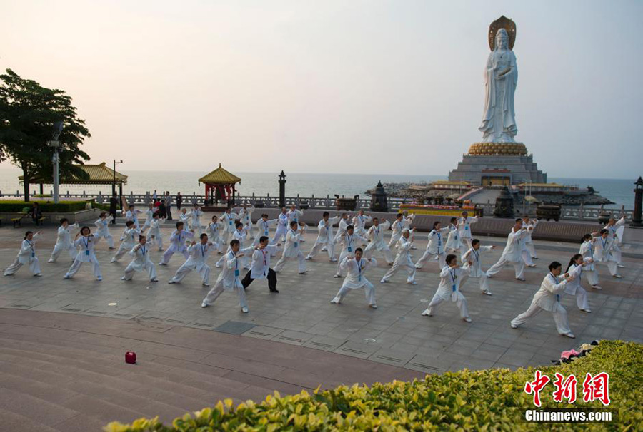 Hundreds of people practice tai chi in spring