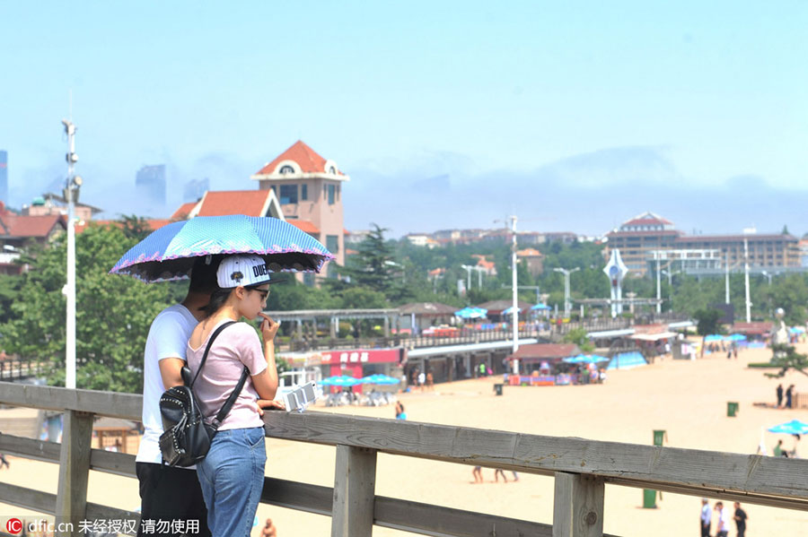 Rising above the clouds: Mist envelops Qingdao