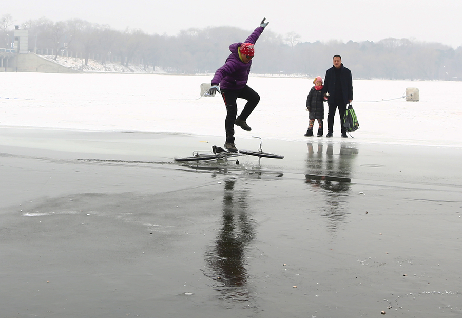 55-year-old man performs bicycle stunts on ice