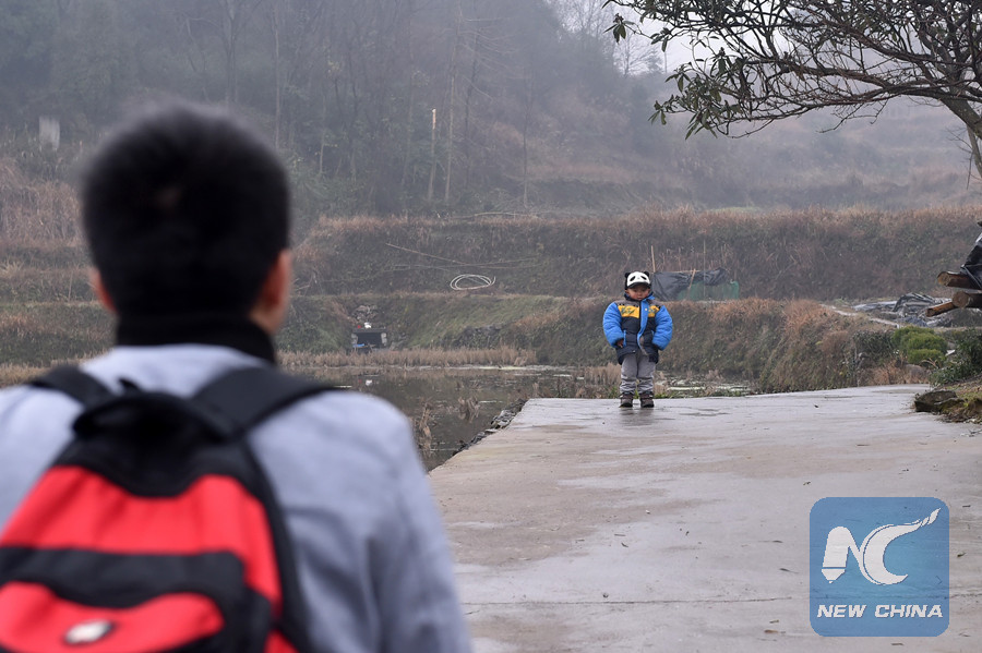 Teary farewell as migrant worker leaves son