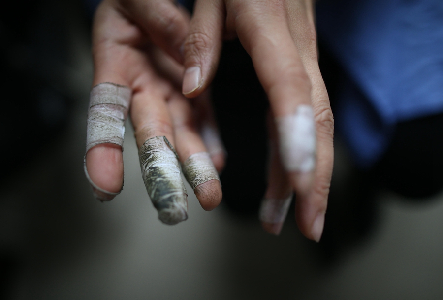 Cramped fingers, 24-hour security and sticky tape all part of a money counter's job