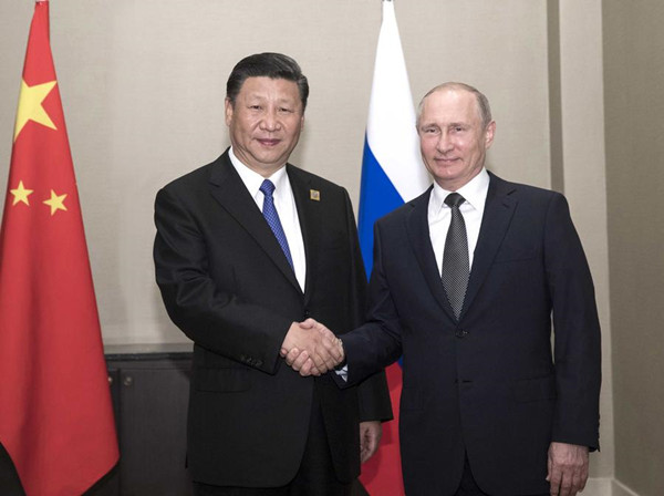 Xi, Putin meet on bilateral ties, SCO development