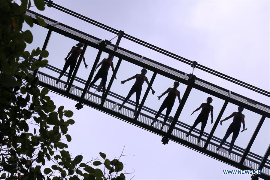 Yoga practiced on suspension bridge