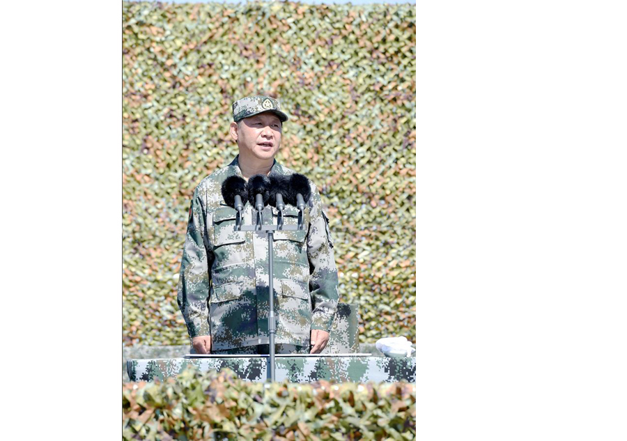 Xi reviews parade in field for first time