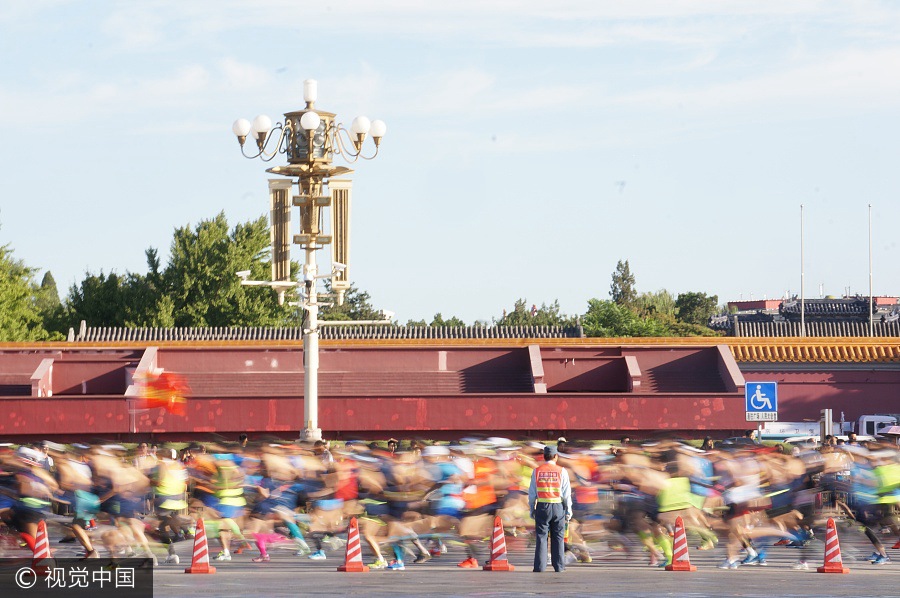 Runners compete during 2017 Beijing Marathon