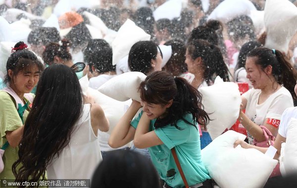 Feathers fly as pillow fight relieves stress of daily life