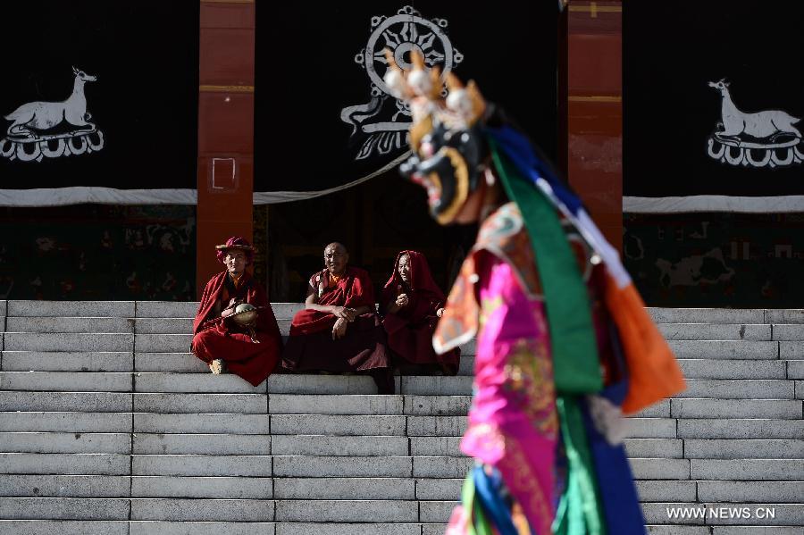 Monks wearing masks rehearse Gesar opera at Chalang Temple in NW China