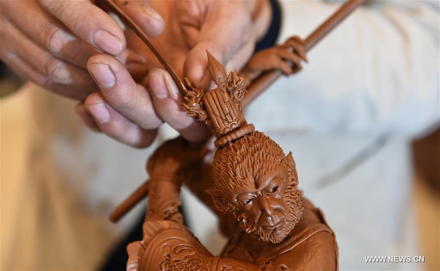 Folk artist makes sculptures of Monkey King to greet Chinese Lunar New Year