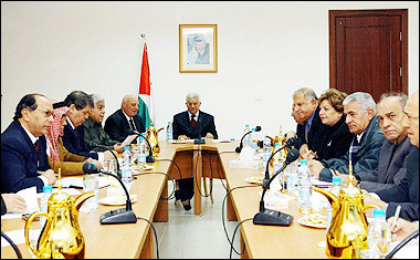 This handout picture released by the Palestinian Authority's press office (PPO) shows Palestinian president-elect Mahmud Abbas (C) heading the first cabinet meeting after his election, in the West Bank city of Ramallah. [AFP]