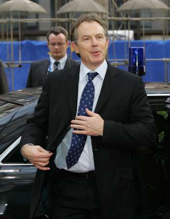 British Prime Minister Tony Blair arrives at the European Council building on the second day of an EU heads of State summit in Brussels, March 23, 2005. [Reuters]