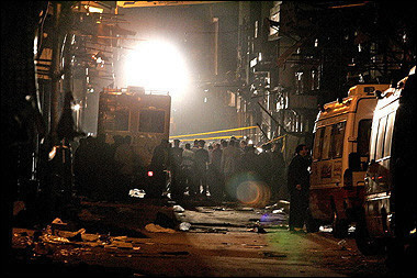 Egyptian police and interior ministry officials gather at the site where a bomb attack occurred in a touristic area in the heart of Cairo. Egyptian security forces have arrested three Islamists suspected of planning last week's suicide bombing in a Cairo bazaar which killed three foreigners, an interior ministry source said.(AFP/File/Marwan Naamani) 