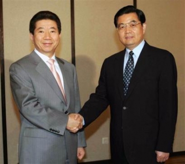 Chinese President Hu Jintao, right, shakes hands with South Korean counterpart Roh Moo-hyun during their meeting in Moscow, Russia, Sunday, May 8, 2005. The two Asian leaders were in Moscow to take part in a celebration of the 60th anniversary of the Allied victory over Nazi Germany. (AP Photo/Xinhua