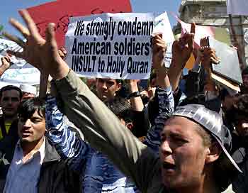 Afghan university students chant anti-U.S. slogans during a protest in Kabul May 12, 2005. Several hundred students in the Afghan capital held a protest on Thursday to denounce the United States over a report that U.S. interrogators at Guantanamo Bay had desecrated the Koran. [Reuters]