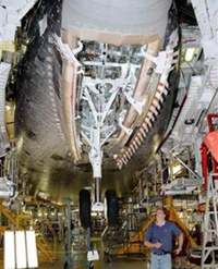 In this 
 photo 
 released by NASA a worker checks the recycling of space shuttle Atlantis' landing gear May 16, 2005 at Kennedy Space Center in Cape Canaveral, Fla. 