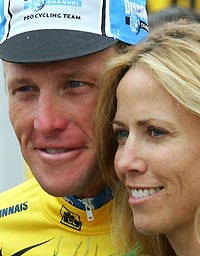 Discovery Channel team rider Lance Armstrong of the US wearing the leader's yellow jersey is seen with pop singer Sheryl Crow of the US after he and his team won the 67.5km (42 miles) fourth stage team time trial from Tours to Blois in the 92nd Tour de France cycling race, July 5, 2005. 