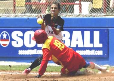 China's Li Chunxia slides safely into third base as USA's Vicky Galindo takes the throw, in the fourth inning at the World Cup of Softball in Oklahoma City, Saturday, July 16, 2005. USA won the game, 11-3. (AP