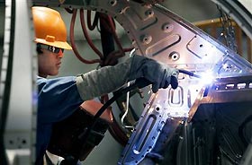 A worker welds the interior of a car at the Geely auto factory in Ningbo, China, earlier this month.