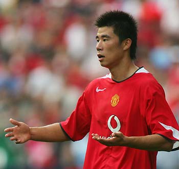 Manchester United's Chinese player Dong Fangzhou reacts during his debut for United against the Hong Kong national team in Hong Kong July 23, 2005.