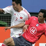 Eight-men China fought hard to earn a 1-1 tie with hosts South Korea in the opening game of the East Asian soccer championship at Daejeon World Cup Stadium on Sunday. 