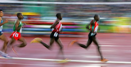 Runners compete in the men's 5,000 metres heat at the world athletics championships in Helsinki, Finland August 11, 2005.