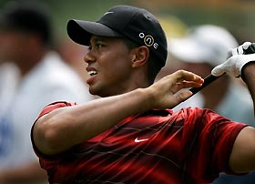 Tiger Woods of the U.S. reacts to an errant tee shot on the seventh hole during the final round of the 2005 PGA Championship at Baltusrol Golf Club in Springfield, New Jersey, August 14, 2005