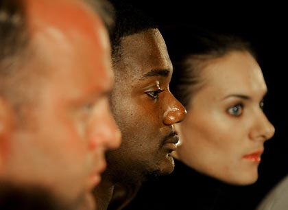 Women's pole vault world champion Yelena Isinbayeva of Russia (R), world champion of the 100 meters and 200 metres Justin Gatlin of the U.S. (C) and the shot put world champion Adam Nelson of the U.S. attend a news conference in Monte Carlo September 8, 2005. The IAAF World Athletics Final will takes place in Monaco on Friday and Saturday.