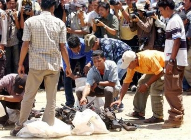 Members of the Free Aceh Movement surrender weapons during handover of weapons to the Aceh Monitoring Mission in Banda Aceh, Indonesia, Thursday, Sept 15, 2005. 