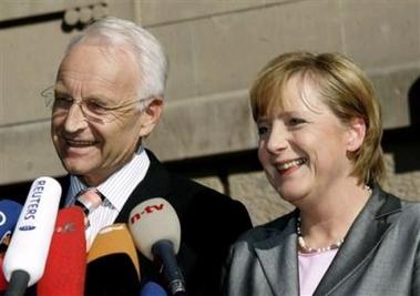 German Christian Democratic (CDU) Chairwoman Angela Merkel, right, and Bavarian state Governor Edmund Stoiber, leader of the CDU's sister party CSU, deliver statements after their talks with the Social Democrats in Berlin Thursday, Sept. 22, 2005.