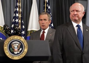 President Bush walks past Secretary of Energy Samuel Bodman, right, to make a statement on the country's energy supply at the Department of Energy, Monday, Sept. 26, 2005 in Washington.