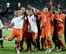 The Netherland's players celebrate after the World Cup 2006, Group One, qualifier soccer match against the Czech Republic at the Toyota Arena in Prague October 8, 2005. The Netherlands won the match 2-0.