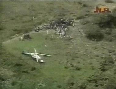 Aerial view image from television of rescuers working at the crash site of a Nigerian jetliner, near Kishi, Nigeria, Sunday Oct 23 2005. It appears all 117 passengers and crew are dead, according to the Nigerian Red Cross after the Bellview airline operated Boeing 737 crashed shortly after takeoff from Lagos, en route to the capital Abuja. [AP]