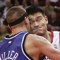 ouston Rockets center Yao Ming collides with Sacramento Kings center Brad Miller as he drives to the basket in the second half as the Rockets beat the Kings 98-89 November 2, 2005 in Houston.