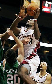 Cleveland Cavaliers' LeBron James (23) shoots over Boston Celtics' Dan Dickau (20) in the fourth quarter of the Cavaliers' 115-93 win Tuesday, Nov. 22, 2005, in Cleveland.