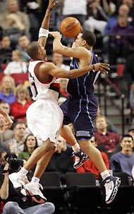 Utah Jazz's Deron Williams shoots as Portland Trail Blazers Sebastian Telfair defends during the first quarter Sunday, Dec. 4, 2005, at the Rose Garden, in Portland, Ore.