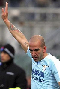 Lazio's Paolo Di Canio waves to his fans as he leaves the pitch after being substituted during the Italian League soccer match between Livorno and Lazio at the Armando Picchi stadium in Leghorn, Italy, Sunday Dec. 11, 2005.