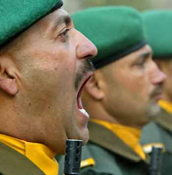 An Indian army soldier shouts commands during 'Vijay Divas' or victory day celebrations in a garrison in Srinagar December 16, 2005.