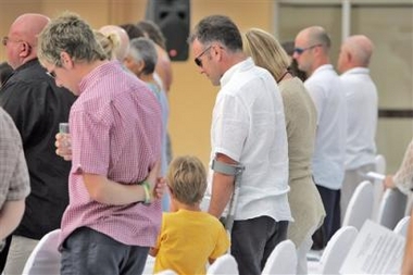 Friends and family members of those British killed in the Asian Tsunami attend a remembrance ceremony Saturday, Dec. 24, 2005, at Patong Beach in Phuket, Thailand.