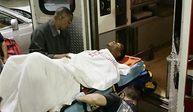 Houston Rockets' Tracy McGrady is loaded into an ambulance after experiencing severe back spasms in the final seconds of the second quarter against the Denver Nuggets in their NBA basketball game on Sunday, Jan. 8, 2006 in Houston.