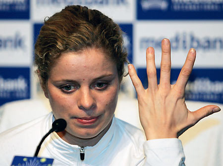 Belgium's Kim Clijsters gestures during a news conference where she announced her withdrawal due to injury from the Sydney International tennis tournament January 11, 2006. Clijsters is doubtful for next week's Australian Open after a hip injury forced her out of the Sydney International on Wednesday. [Reuters]