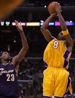 Los Angeles Lakers' Kobe Bryant goes up for the go-ahead basket over Cleveland Cavaliers' LeBron James during the final seconds of an NBA basketball game Thursday, Jan. 12, 2006, in Los Angeles. The Lakers won 99-98.