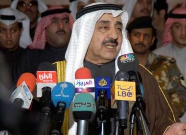 Kuwait's Speaker of Parliament Jassim al-Kharafi (C) speaks to reporters as he leaves the Parliament building on January 23, 2006. 