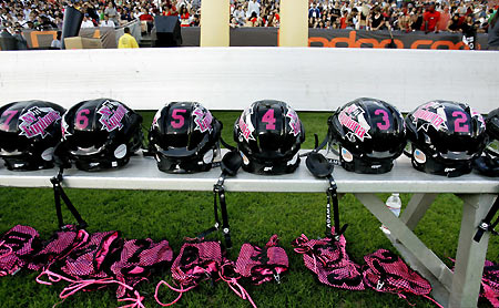 Los Angeles Temptation(blue) play against New York Euphoria during the third annual Lingerie Bowl football game in Los Angeles February 5, 2006. The 30-minute game features models playing full-contact football in lingerie and airs locally on pay-per-view during half time of the NFL's Super Bowl XL football game. [Reuters]